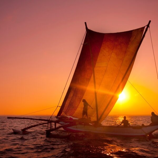 Fishermen on a catamaran at Sunset. Sri Lanka